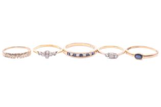 Five gem-set rings, to include a diamond three-stone ring, testing as 18ct, ring size J, an old