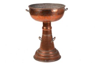 A large floor-standing copper jardiniere, hand-hammered in the arts and crafts style, 78 cm x 53