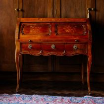 A Louis XV fruitwood and marquetry inlaid cylinder bureau, the cover opening to reveal a four-drawer
