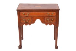 A George III mahogany lowboy, with satinwood, boxwood and ebony stringing, the top with later patera