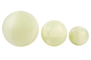 Lisa Zerkowitz (Contemporary) American, three glass graduated beach balls, in jade green, the