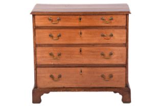 A small George III mahogany chest of drawers, the rectangular top with moulded edge over four long