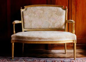 A 19th-century carved wood and gilt gesso two-seat sofa, probably English in the French taste with