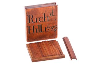 A set of Napier's Bones, the fruitwood case inscribed Richard Hill 1742, 7.5 cm x 6.2 cm.