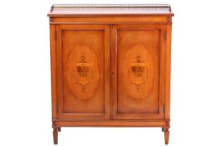 A reproduction George III style mahogany side cabinet, the pierced brass half gallery over a pair of