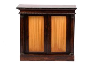A Regency rosewood chiffonier, the green marble top over a pair of silk lined cupboard doors flanked