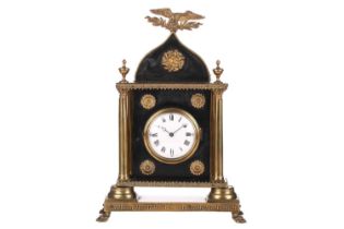 A French Empire ebonised and gilt-metal mantel timepiece clock, the eagle surmount over rosettes and