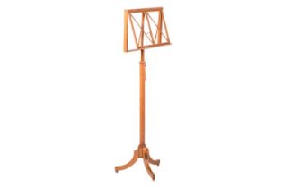 An early 20th-century oak and ebony strung music stand by Liberty's, the adjustable rectangular
