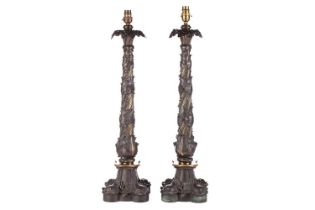 A pair of Victorian-patinated bronze table lamps, late 19th-century oil lamp base conversions with