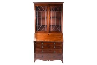 A George III mahogany bureau bookcase with an astragal glazed upper section over a base with a plain