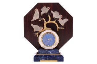 An Art Deco-style lapis lazuli desk clock with a dodecanal dial with a gilt bronze branch surmount