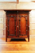 An 18th-century Dutch oak Schrank, the moulded cornice above a pair of arched panel doors,