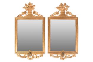 A pair of George IV carved wood and gilt gesso rectangular girandole mirrors, with surmount of