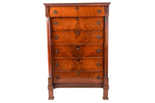 A French Louis Philipe flame grain mahogany pedestal chest, with a jettied top drawer above a pair