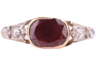 A George III garnet and diamond ring, featuring a central cushion shape garnet measuring 8.2 x 6.