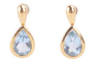 A pair of sky blue topaz drop earrings in 18ct yellow gold, featuring bezel set pear-shaped blue