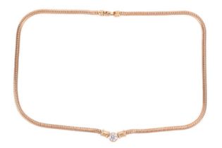 Theo Fennell; a diamond single stone necklace, set with a round brilliant cut diamond with a