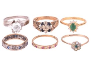 A collection of six stone set rings including a 9ct yellow gold sapphire and diamond floral