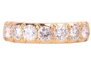 A diamond half hoop ring, set with a row of seven round brilliant cut diamonds with a total