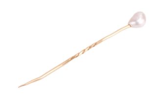 A baroque pearl stick pin. Pearl measures approximatley 11.3mm x 8.5mm. Length 8cm. Yellow metal