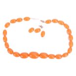 A simulated amber bead necklace, the beads graduating in size with the largest bead measuring 22.3 x