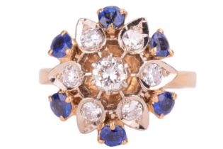 A diamond and sapphire cluster ring, in a floral design set with round brilliant cut diamonds with a