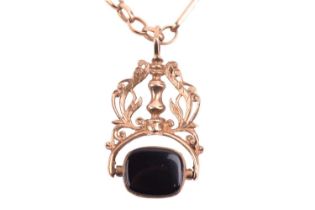 A swivel fob and chain in 9ct yellow gold, featuring an onyx seal and a gold seal depicting the