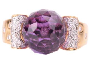 An amethyst and diamond ring, featuring a round briolette cut amethyst with a diameter of 11.2mm,