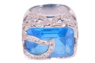 A blue topaz and diamond cocktail ring, containing a large Swiss blue topaz approximately measures