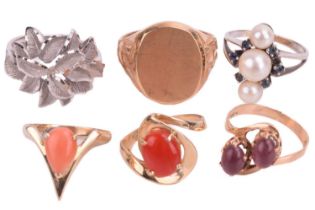 A collection of six rings, including pearl set and gem-set. Featuring a yellow metal signet ring