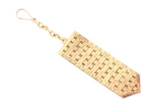 A key chain designed as an articulated woven textured lattice with chevron terminal, to a chain