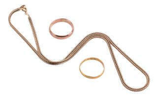 Two wedding bands and a chain necklace; the foxtail chain necklace measuring 39.5cm in length, and