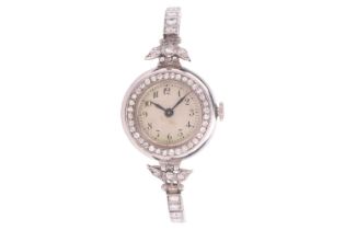 A 1930's diamond set platinum dress watch, featuring a hand-wound movement in a white metal case