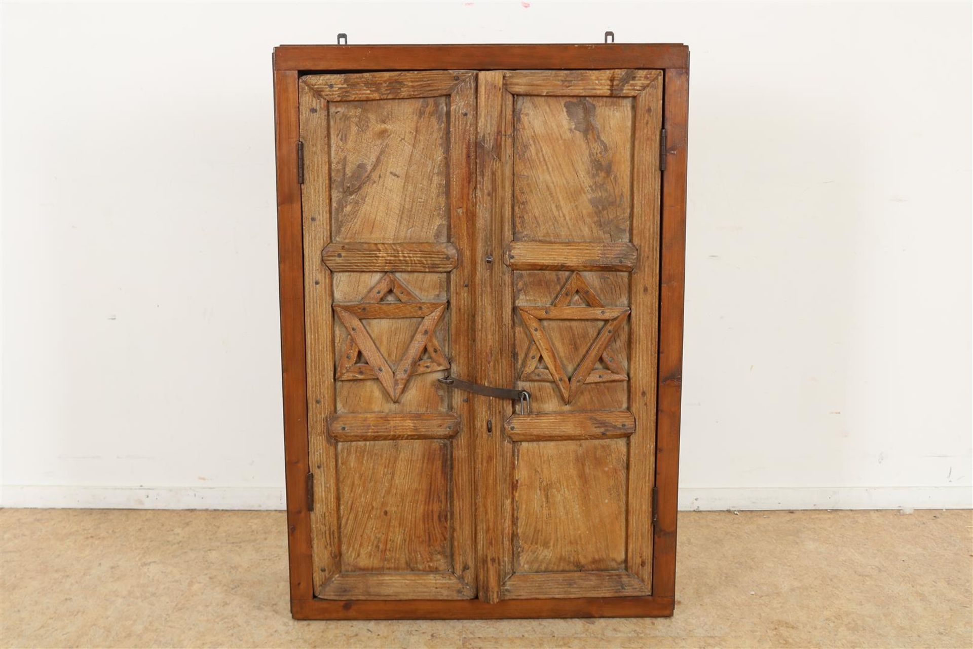 Oak veneered hanging cabinet with 2 teak doors with relief of "Jewish" Star of David, h. 112, w. 77,