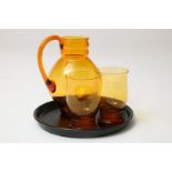 Amber colored water set, design Andries Copier