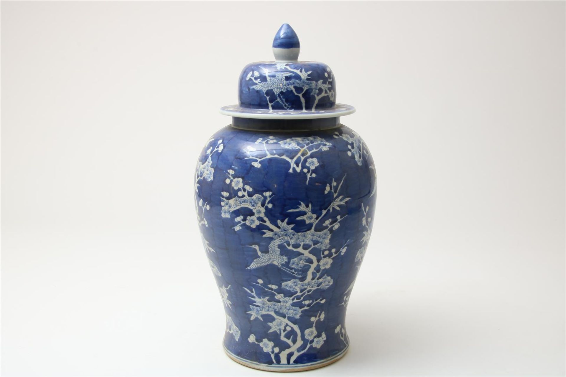 Blue and white porcelain lidded vase decorated with blossom branches and cranes, China 20th century,