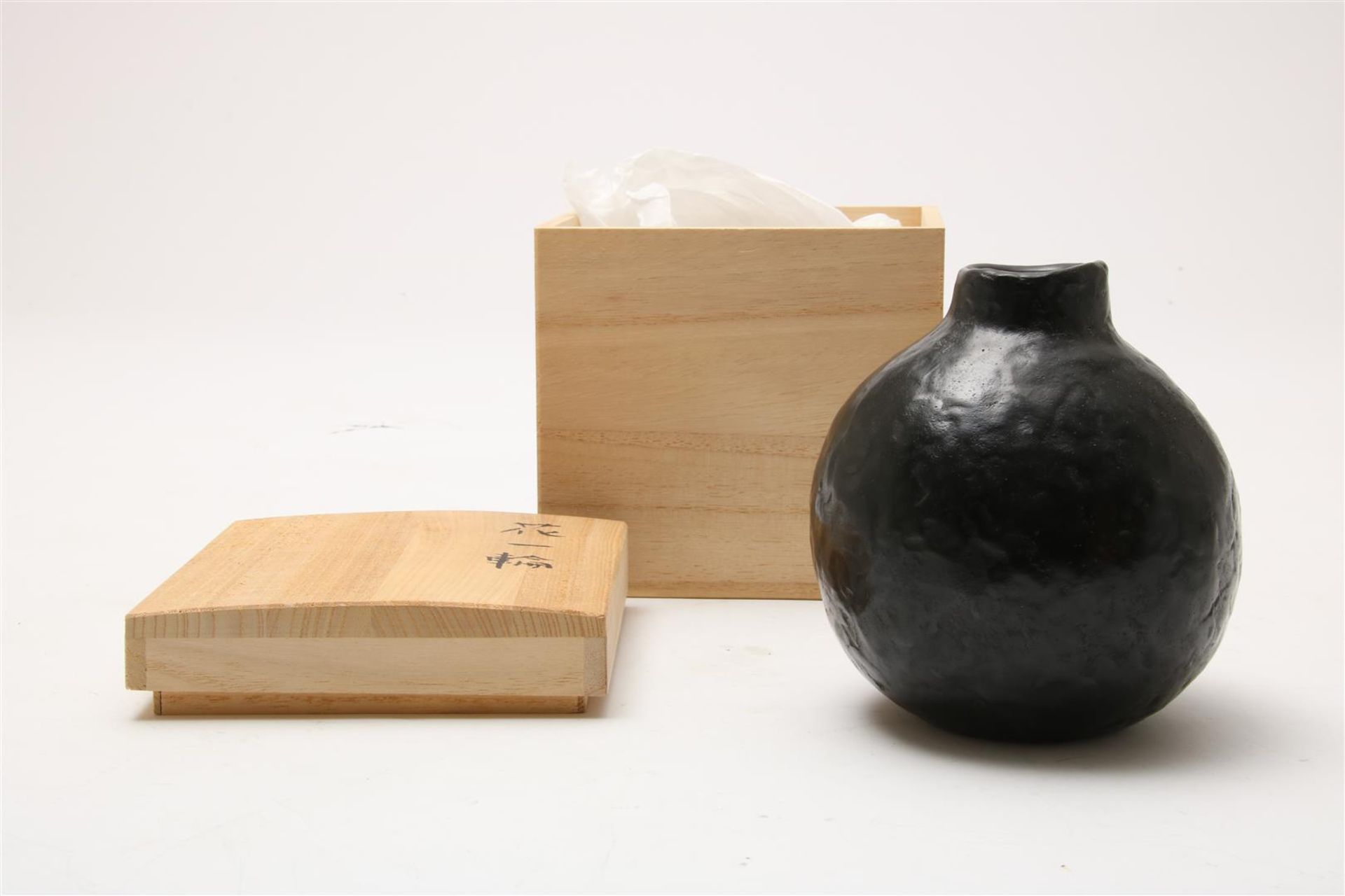 Black patinated bronze ceramic-looking ball vase