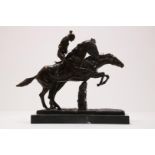 Bronze sculpture of jockeys on horseback