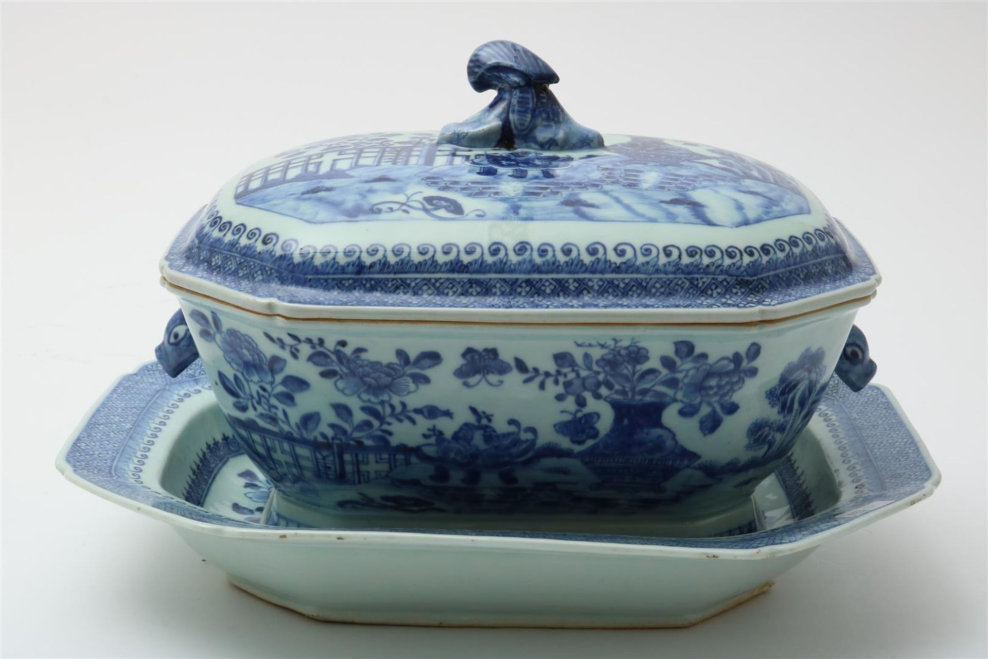 Porcelain Qianlong tureen under cover on a dish decorated with flowers in a landscape, China 18th