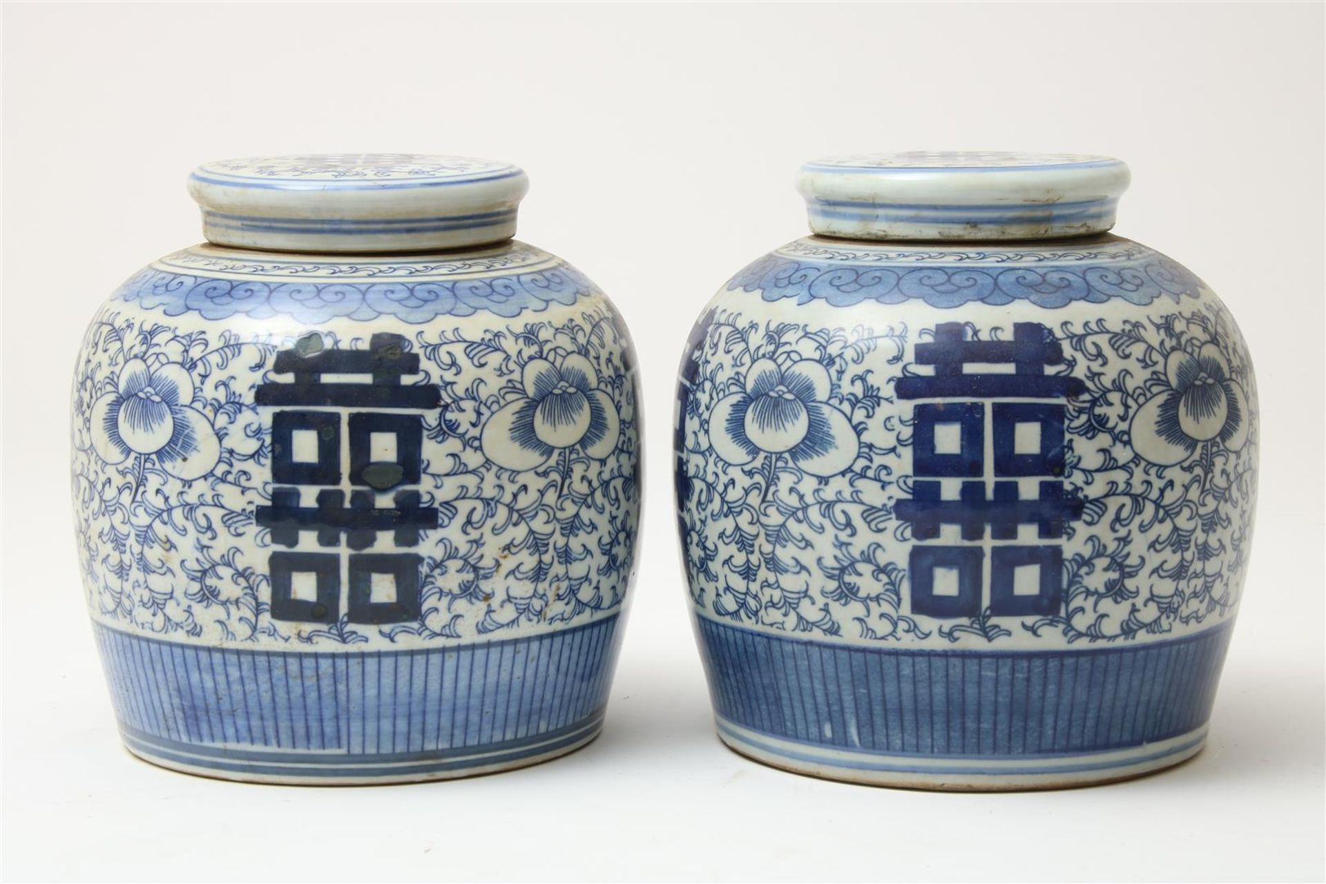 Set of blue and white porcelain ginger jars with lids decorated with blossom branches and