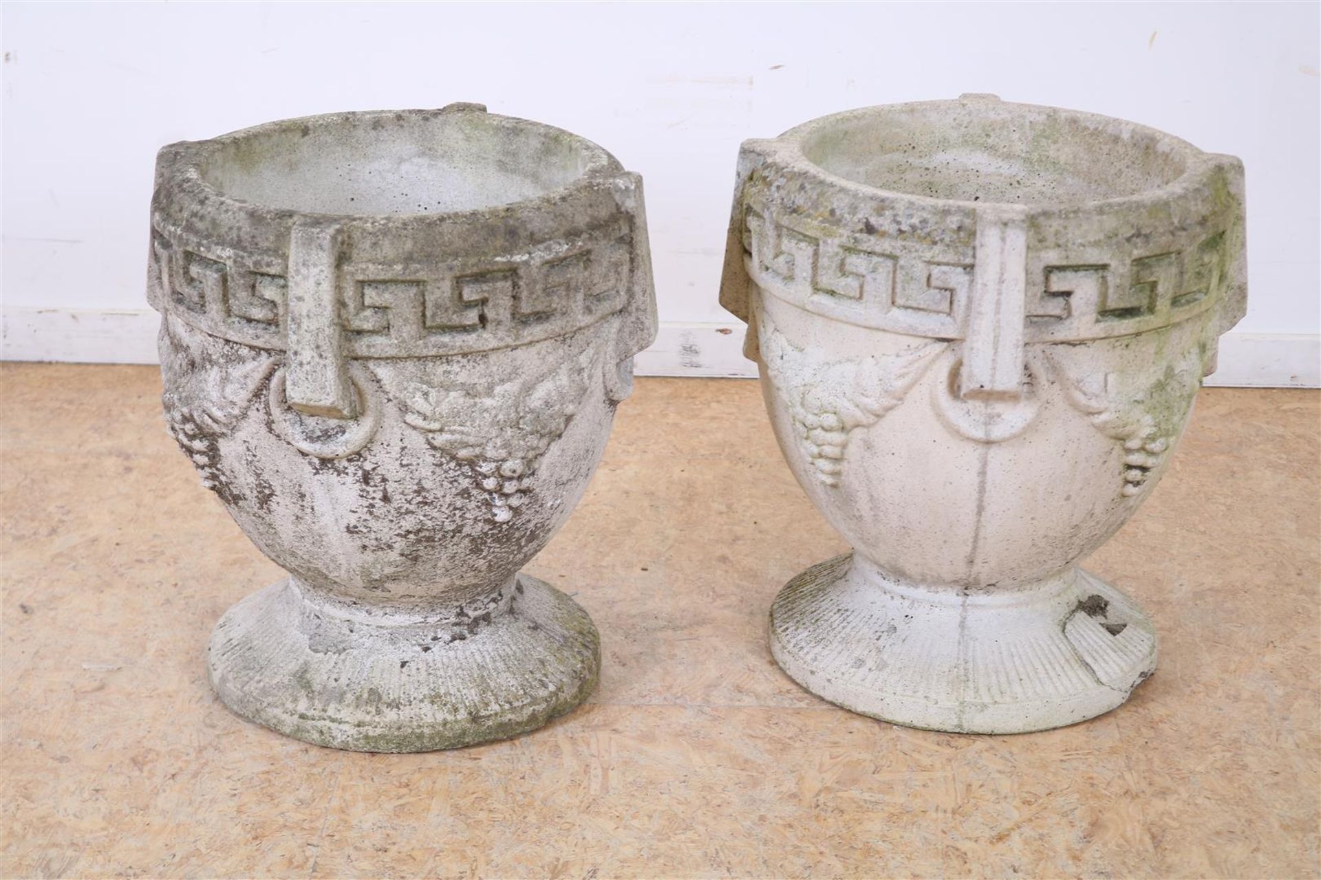 Set of concrete garden vases with Greek border decoration