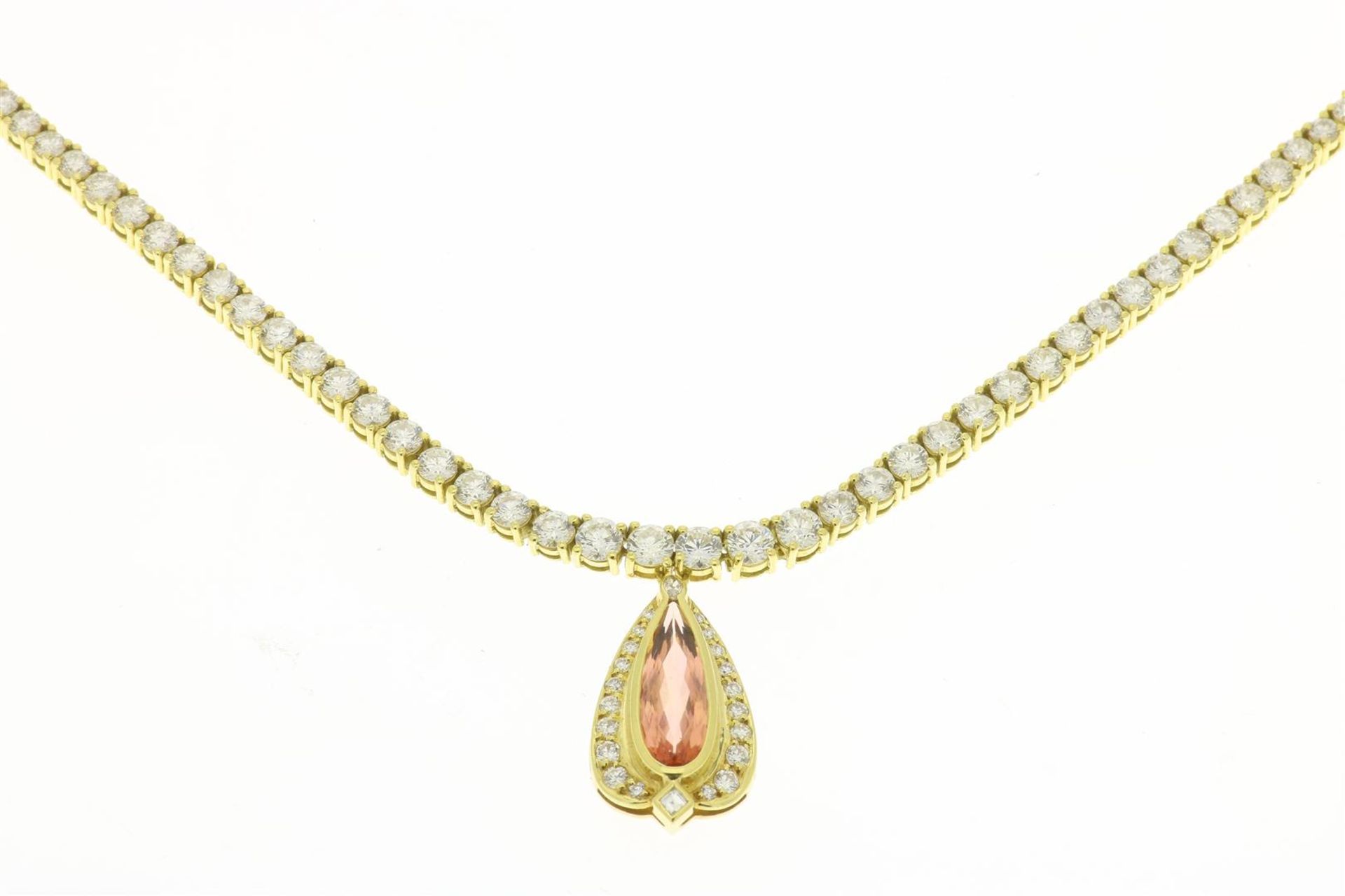 Yellow gold tennis necklace set with brilliant cut diamonds
