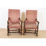 Pair of oak armchairs with carved armrests and legs