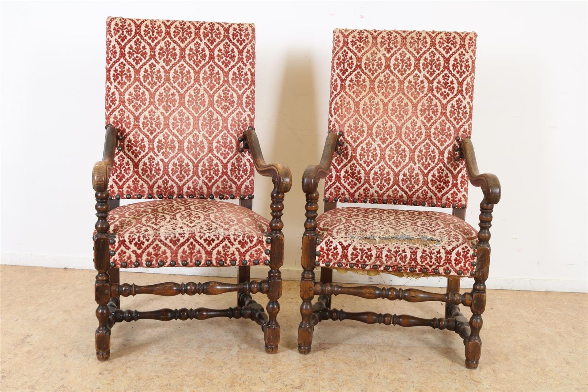 Pair of oak armchairs with carved armrests and legs