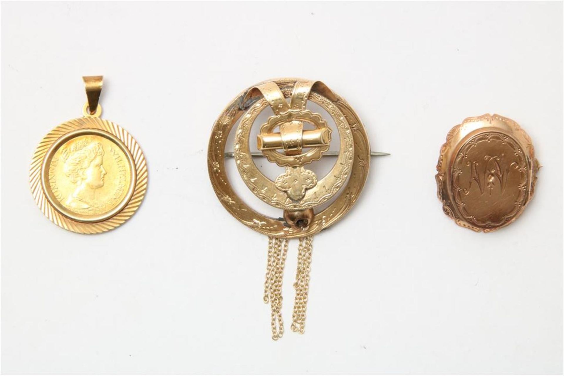 Golden coin and 2 brooches 