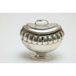 Silver lobed tea caddy decorated with snake