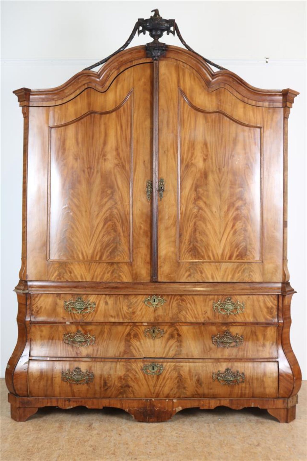 Mahogany Louis XVI cabinet, crowned with carved vase ornament and garlands, 2 panel doors and 3