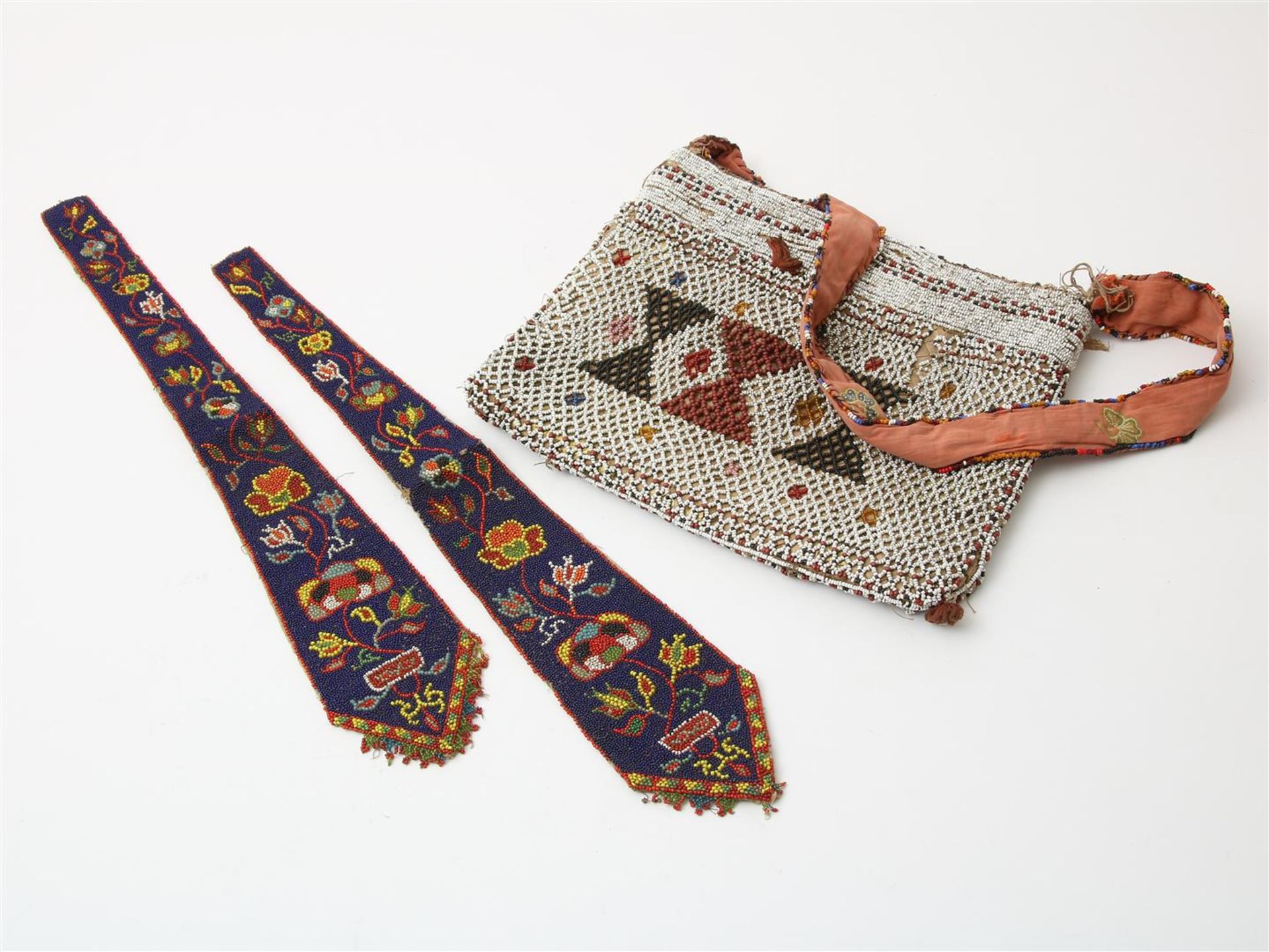 Two ornaments with glassbeaded floral decoration and Sirih bag