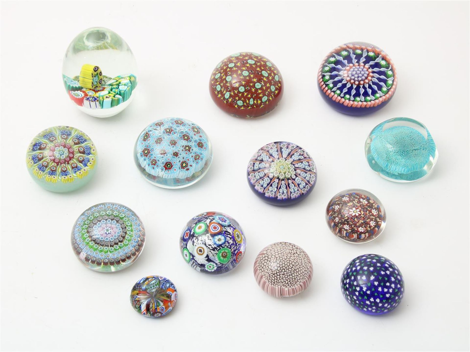Set of 13 paperweights, with enclosed Millefiori decor, marked (stickers): Murano, various sizes