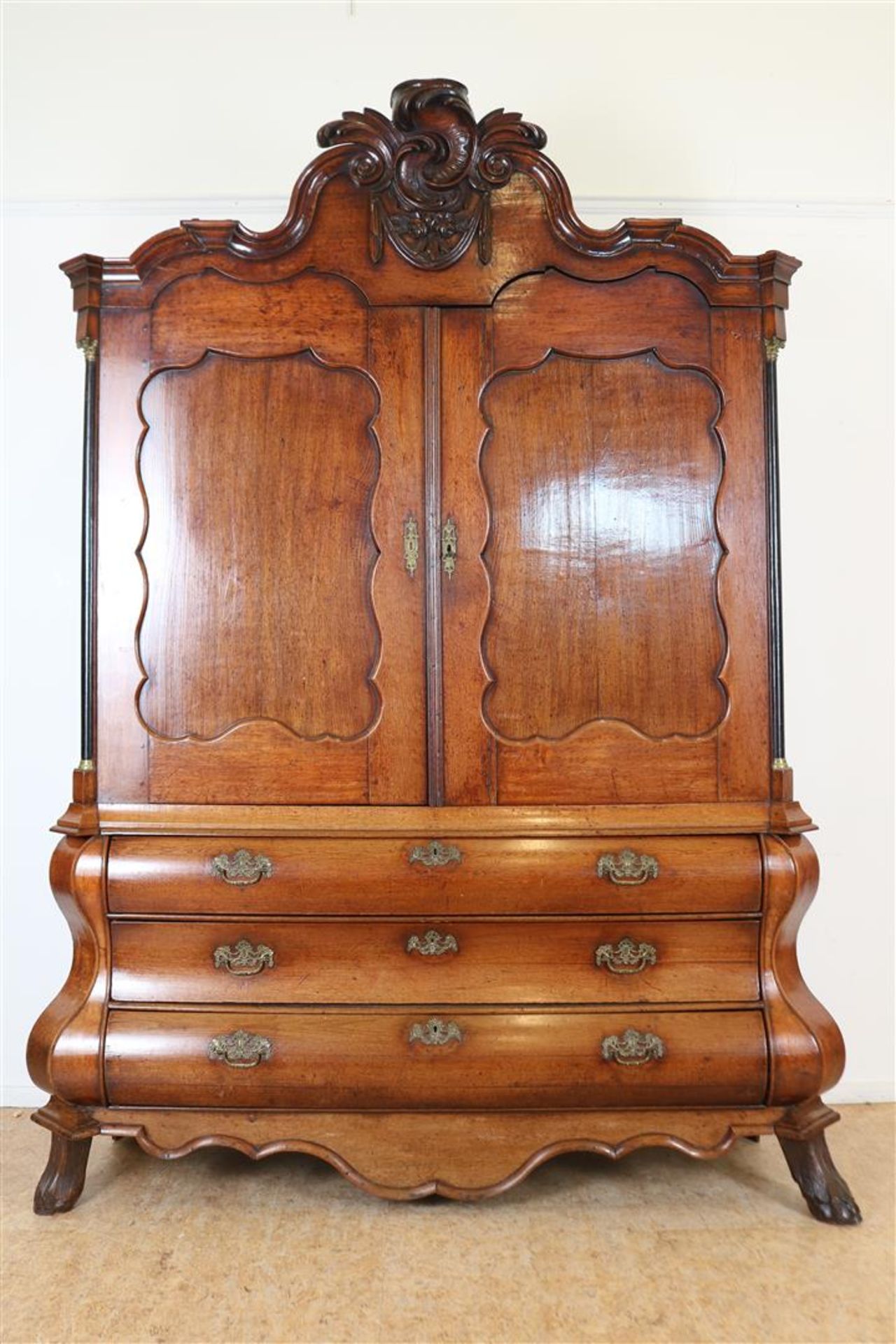 Oak Louis XV cabinet with carved ornament in double curved hood, 2 panel doors on 3 curved drawers